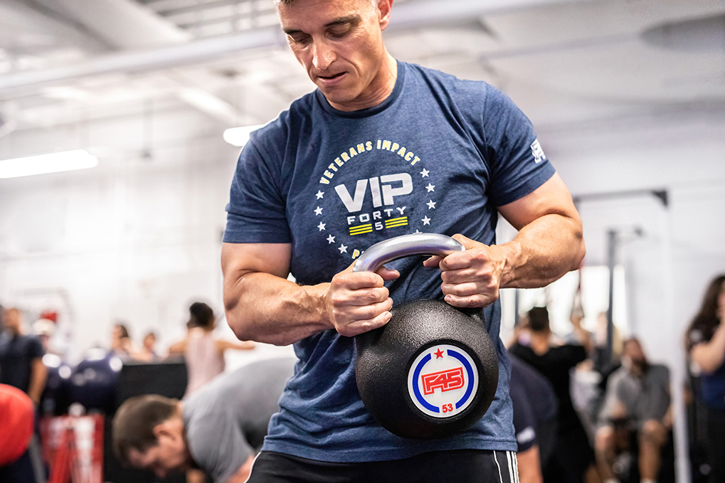Man Lifting Weight in F45 Training